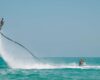 How can you play Destin water sports easily?